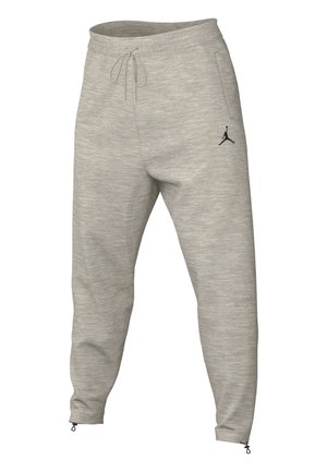 Hellgraue, schmal zulaufende Sweatpants mit elastischem Bund, Kordelzug, seitlichen Taschen, Reißverschlüssen am Knöchel und schwarzem Jumpman-Logo am linken Oberschenkel.