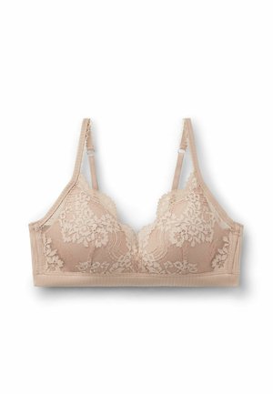 Lace bralette in nude met bloemenpatroon, zachte padding en verstelbare bandjes. Satijnen rand langs de onderkant en golvende randen.
