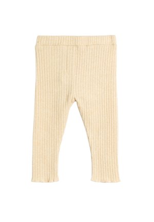 Leggings côtelés beige en tissu doux, dotés d'une taille élastique et d'une coupe ajustée, se terminant juste au-dessus de la cheville avec un ourlet effiloché.