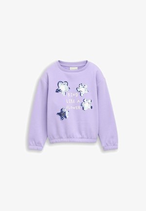 Felpa lilla con maniche lunghe, con quattro forme di fiori di paillettes argento e il testo "Kind like a flower" al centro.