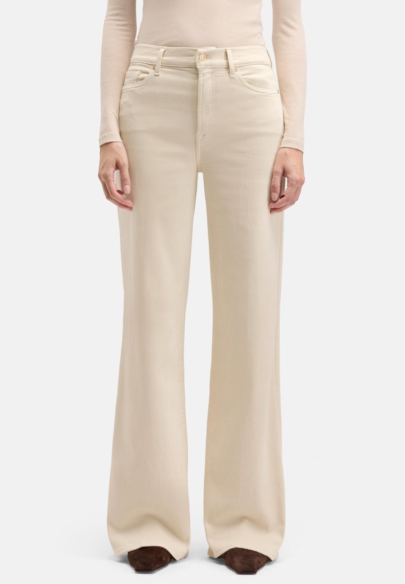 Beige wijde jeans met een hoge taille, voorzien van voorzakken en een subtiele textuur. Gestructureerde pasvorm, gemaakt van een lichtgewicht katoenmix.