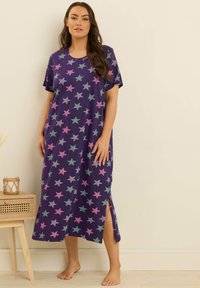Vestaglia viola con maniche corte, caratterizzata da un motivo a stelle in rosa, verde e argento. Le fessure laterali aumentano la mobilità; tessuto di cotone morbido.