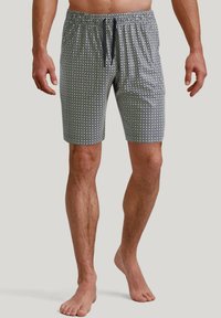 Men's swim shorts in a patterned fabric with navy blue and white geometric designs. Features an elastic waistband with drawstring.