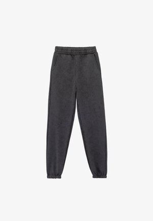 Mørkegrå jogger-style bukser lavet af blødt stof, med en elastisk talje, sidelommer og elastiske manchetter ved anklerne.