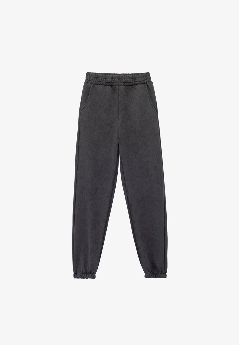 Mörkgrå joggerbyxor i mjukt tyg, med elastisk midja, sidofickor och elastiska mudd vid anklarna.