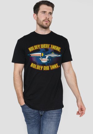 Black cotton t-shirt featuring a graphic print with "BOLDLY WENT THERE, BOLDLY DID THAT" text and an illustrated starship design.