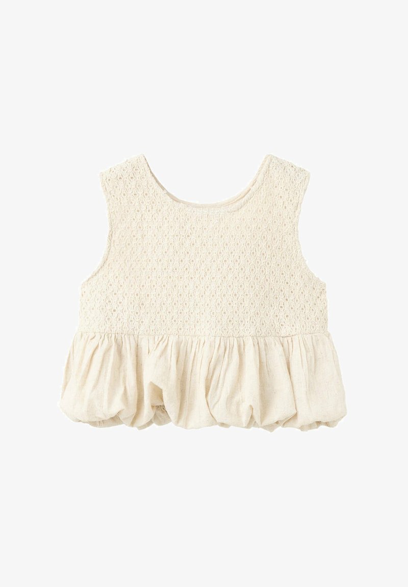 Haut sans manches couleur crème pour fille avec haut en maille texturée et bas en tissu froncé et bouffant.