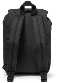 Black backpack with a reinforced top handle, padded shoulder straps, and smooth fabric texture. Features a minimalist design with no visible logos.