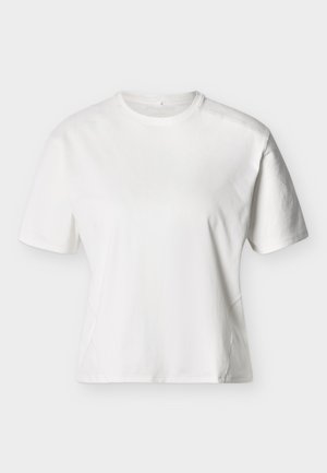 Biele tričko s krátkym rukávom a okrúhlym výstrihom, vo voľnom strihu s jemnými švami na prednej strane a ramenách.
