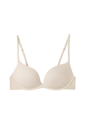 Beige gewatteerde bh met verstelbare bandjes, een gladde textuur en een naadloos ontwerp, voorzien van een haak-en-oogsluiting aan de achterkant.