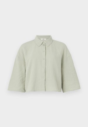 Light green, short-sleeved button-up shirt made of textured fabric, featuring a pointed collar and a loose fit with a straight hem.