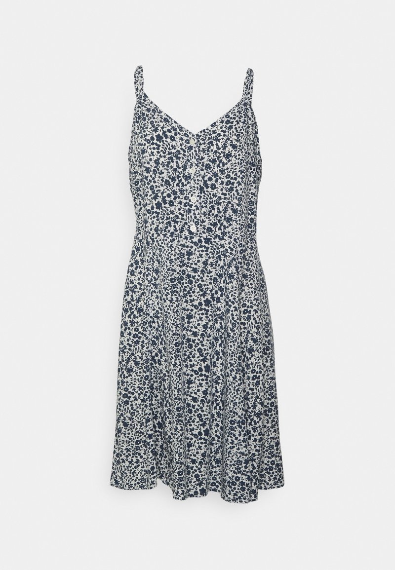 Mörkblå och vit blommig ärmlös klänning med knappar fram och smala axelremmar.