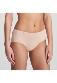 Beige hipster underwear made from smooth fabric, featuring a seamless design and a small decorative logo on the waistband.