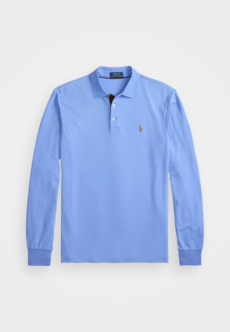 Lyseblå langermet polo skjorte laget av bomull, med en knappestolpe med to knapper, ribbestrikkede mansjetter, og et brodert logo på venstre bryst.