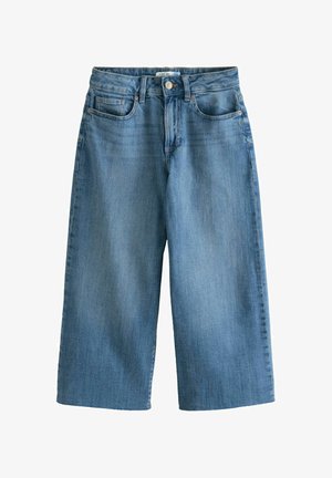 Heledad denim-keep toimelisingud helesinisel toonil, millel on nupupeatus, viis taskut ja sile tekstuur. Jalad ulatuvad poole sääreni.