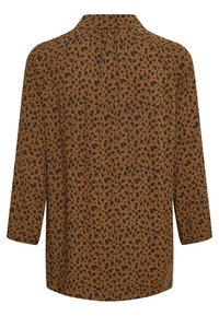 Chemise marron à manches longues avec un petit motif léopard noir vue de dos.