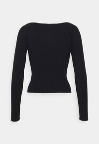 Haut à manches longues en maille côtelée noire avec une taille cintrée et un subtil détail de boutons au niveau de l'encolure arrière.