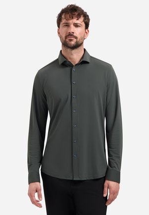 Donkergroen shirt met lange mouwen van gladde stof, voorzien van een knoopsluiting met blauwe knopen en een gestructureerde kraag.