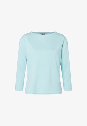 Light blue long-sleeve top made of soft fabric. Features a round neckline and a straight cut, providing a relaxed fit. No visible patterns or accents.