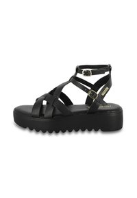 Sandalo in pelle nera con cinturini incrociati, fibbia alla caviglia regolabile e suola spessa. Presenta un bordo testurizzato per una migliore aderenza.