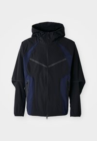 Black and navy zip-up jacket with a hood, featuring a lightweight fabric, diagonal seam accents, and side zip pockets.