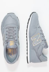New Balance GW500 - Joggesko - grey/gold