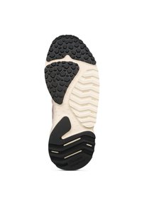 Suola della scarpa con un battistrada in gomma nera a contrasto e motivi testurizzati, bordata da un intersuola di colore crema e un bordo testurizzato.