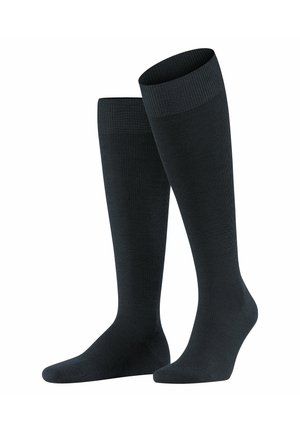 Knee-high black socks with a ribbed top, smooth texture, and reinforced toe; designed for comfort and support.