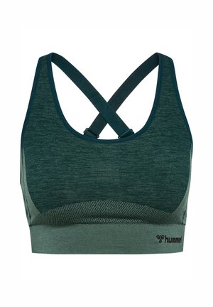 Grøn sportstop med et tekstureret, åndbart stof. Har et krydsrygdesign med justerbare stropper og et fladt, elastisk bånd i bunden.