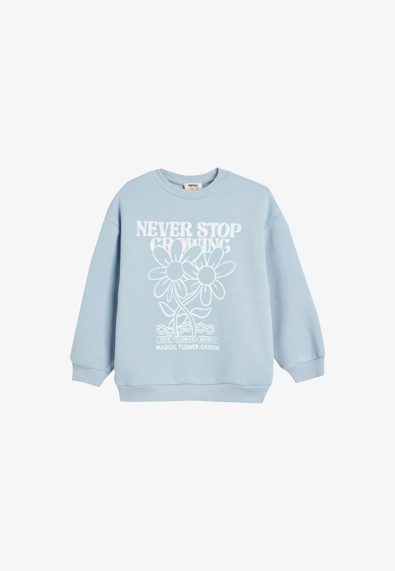 Sudadera de color azul claro en mezcla de algodón, con mangas largas y cuello redondo. Presenta un estampado gráfico blanco de flores y el texto: "NUNCA DEJES DE CRECER."