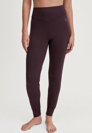 Bordeauxkleurige hoge taille legging gemaakt van rekbare stof, met een getailleerd ontwerp, enkelmanchetten en een subtiele logodetail op de tailleband.