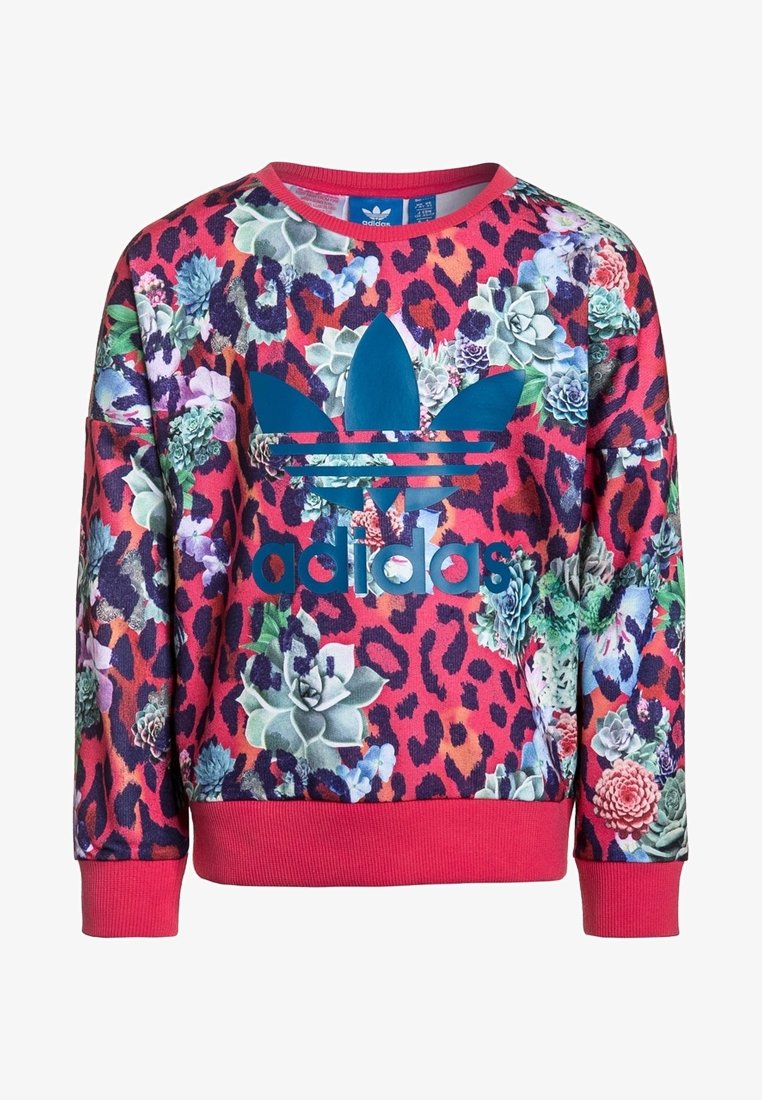 Sudadera roja y rosa con un dobladillo ajustado, que presenta un patrón de flores y estampado de leopardo. Gráfico en azul en el centro. Textura de tela suave.