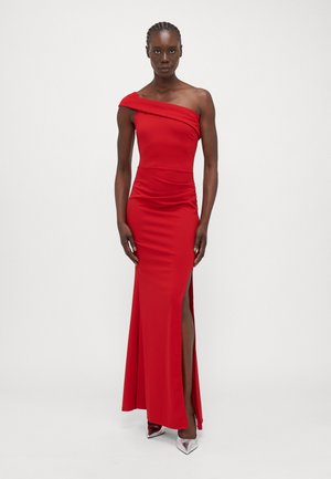 Red, one-shoulder dress made of smooth fabric with a fitted shape, featuring a thigh-high slit and ruching detail on the side.