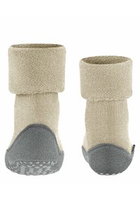 Calze a stivaletto beige con texture, suola in gomma grigia e dettagli. Il risvolto aggiunge supporto e calore. Fondo antiscivolo con punti di presa.