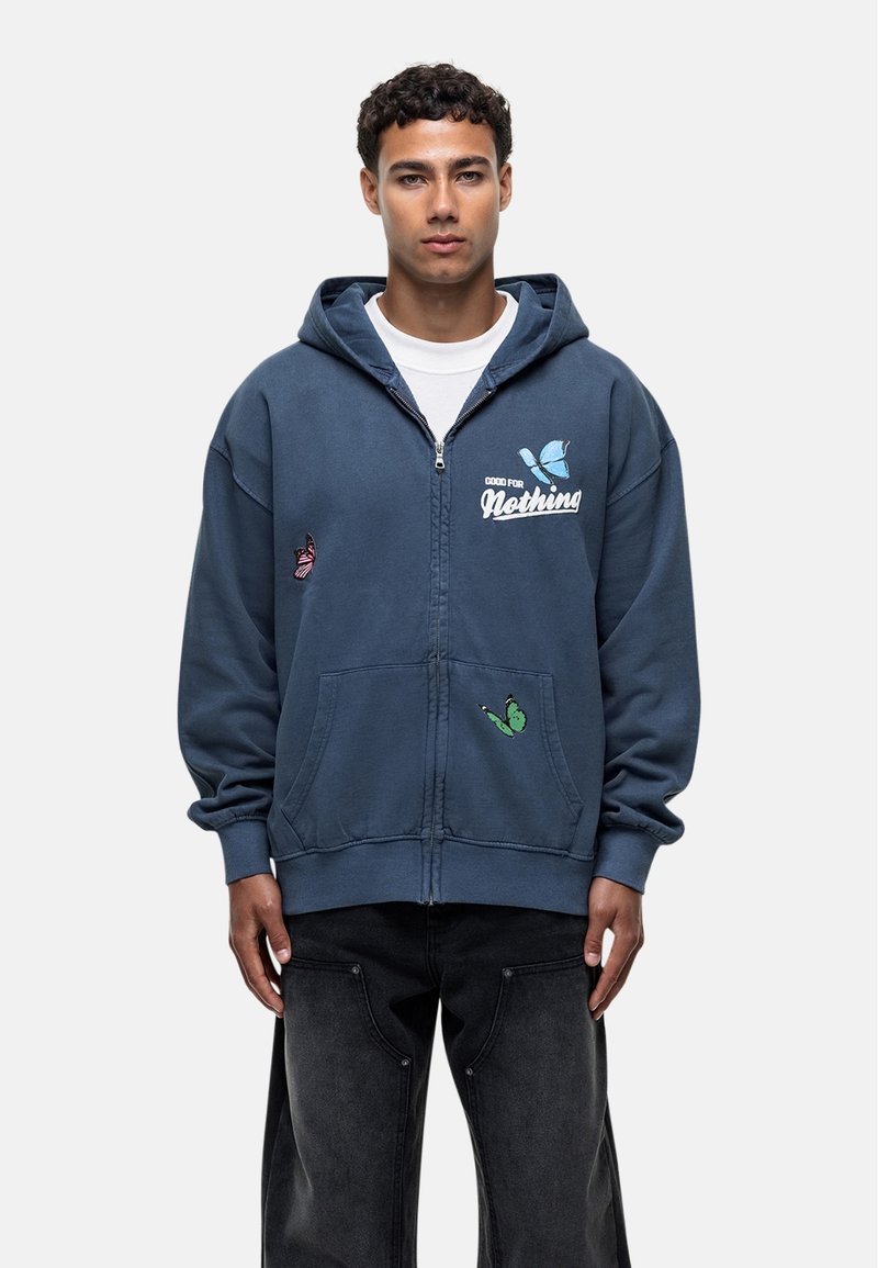 Blue zip-up hoodie made of soft fabric with two front pockets, featuring colorful butterfly embroidery and a logo print on the chest.