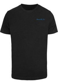 Black cotton t-shirt with short sleeves, featuring blue text "Wings Of Fire" on the upper left chest. Simple and solid design.