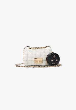 Tweed handbag in white with a gold-tone clasp and chain strap, paired with a black round pouch featuring decorative hardware and accents.
