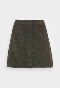 Jupe en velours côtelé vert foncé avec une silhouette droite, dotée d'une fermeture à boutons sur le devant et de deux poches avant. Tissu texturé avec des lignes finement côtelées.