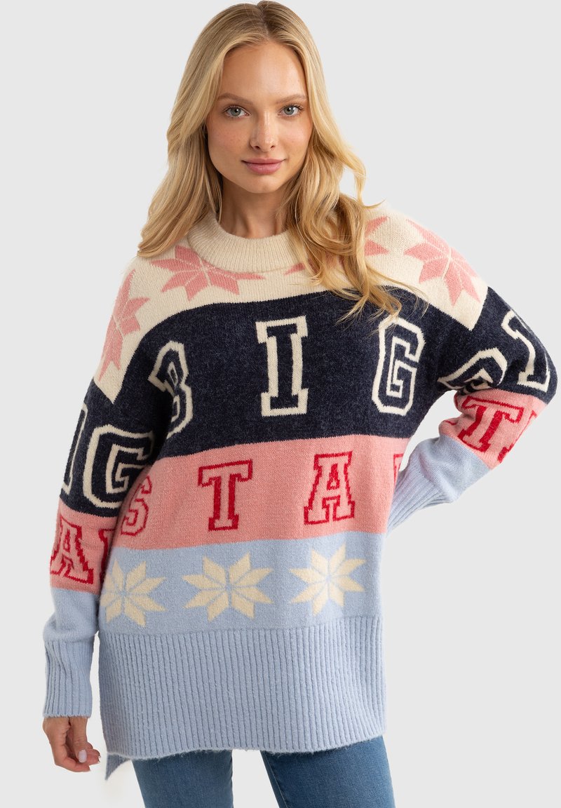 Sweter dzianinowy z kolorowym wzorem w odcieniach kremowym, granatowym, różowym i jasnoniebieskim, z wyrazistym napisem oraz wzorami płatków śniegu. Ribbed dół.