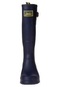 Botte de pluie en caoutchouc bleu marine avec une semelle texturée, un patch logo et un détail de boucle réglable sur le côté, présentant une finition lisse.