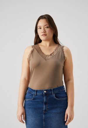 Light brown sleeveless top with a V-neck, featuring floral lace trim on the shoulders. Paired with a high-waisted blue denim skirt.