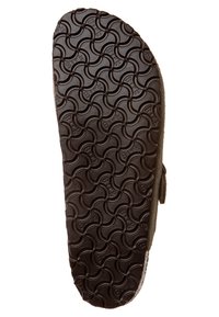 Suola di scarpa in gomma marrone scuro con un motivo a onde e testo in rilievo, dotata di una superficie testurizzata per migliorare la presa e la durata.