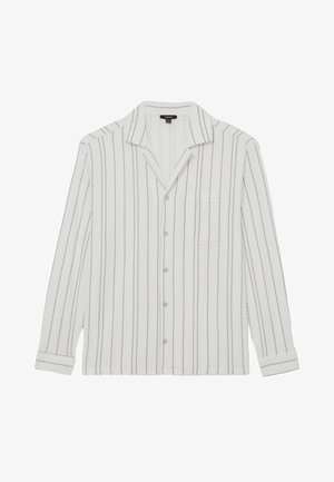 Valkoinen pitkähihainen paita mustuine pystysuorine raidoineen, nappikiinnitys edessä, leveä kaulus ja vasemmalla puolella rinnantasku.