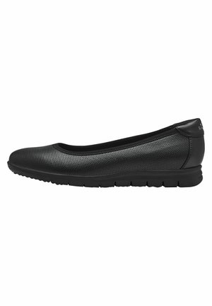 Black ballet flats with a textured perforated upper, rounded toe, and flexible rubber sole. Smooth accents near the heel.
