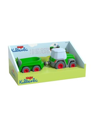 Green plastic toy tractor with gray accents, red wheels, and a detachable trailer. Packaged in a light green box with branding and illustrations.