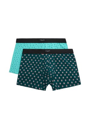 Dos pares de calzoncillos bóxer para hombre con cinturillas negras, uno turquesa con pequeños estampados de palmeras, otro verde oscuro con patrones de calaveras rojas y blancas.