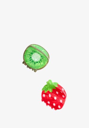 Green kiwi-shaped clip with textured detail and silver accents above a red strawberry-shaped clip with white polka dots and green leaf.