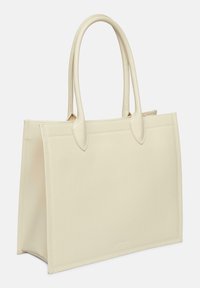 Beżowa syntetyczna torba na ramię z dwiema zakrzywionymi rączkami, o sztywnej formie, gładkiej fakturze, bez widocznych elementów metalowych lub wzorów.