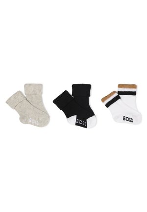 Three pairs of socks: light gray ribbed, black ribbed, and a white pair with brown and black stripes at the cuff, all with "BOSS" branding.