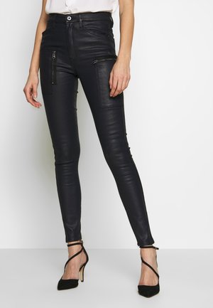 Skinny-Farkut - coated denim